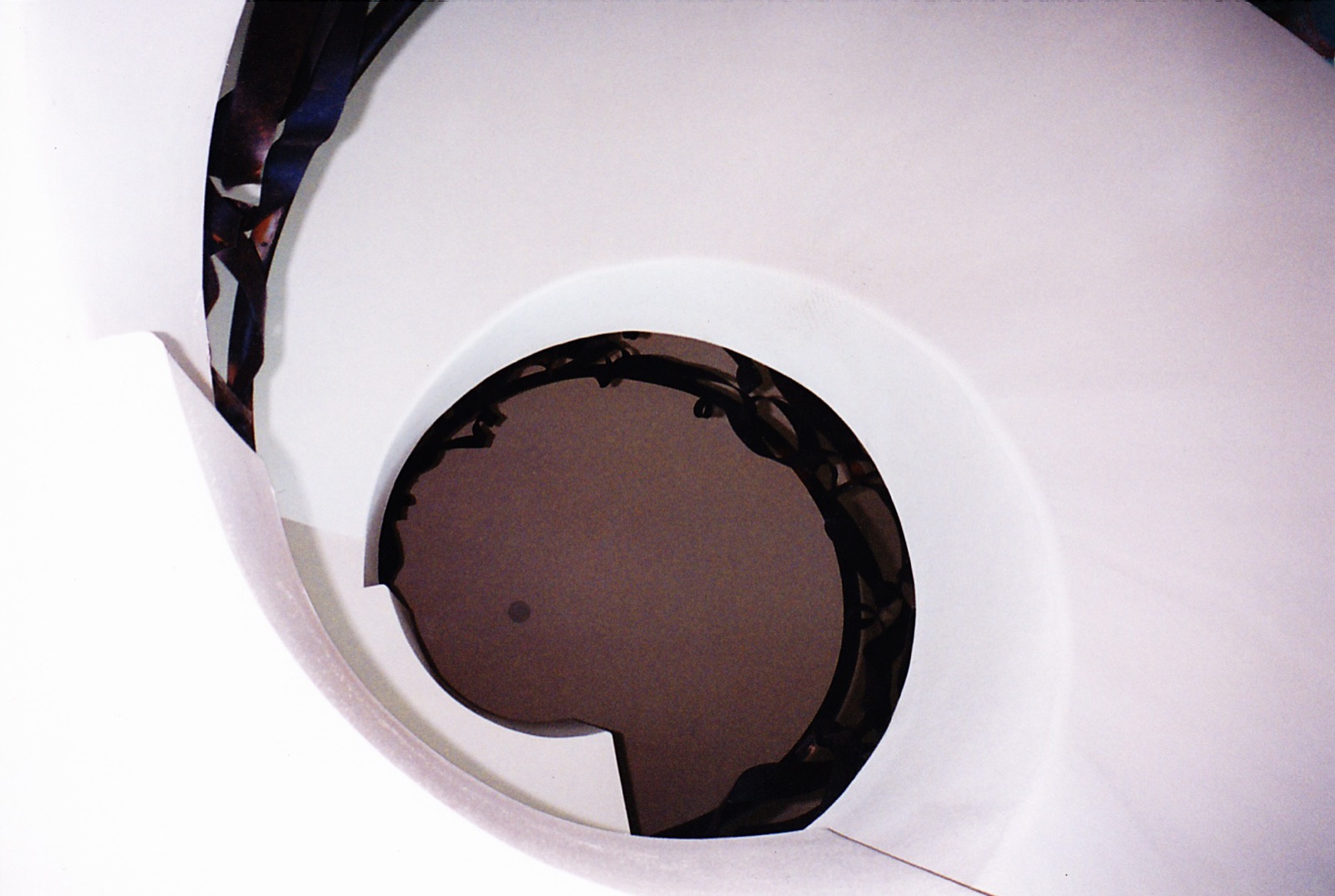 Curved plaster staircase finished by Ken Meyer Stucco